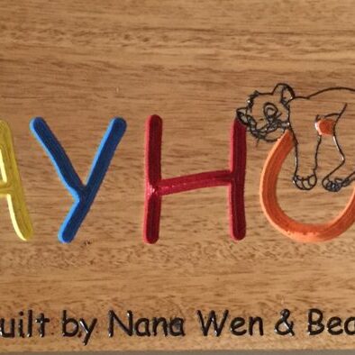 This sign hangs outside a cubby house built by grandparents. They wanted something a little playful.